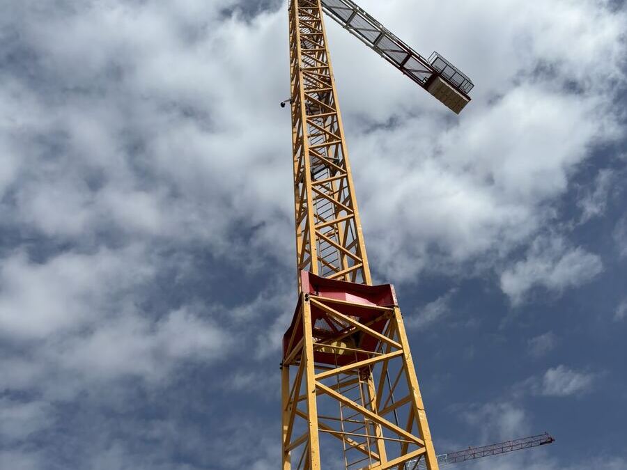 Looking up the mast of a yellow tower crane