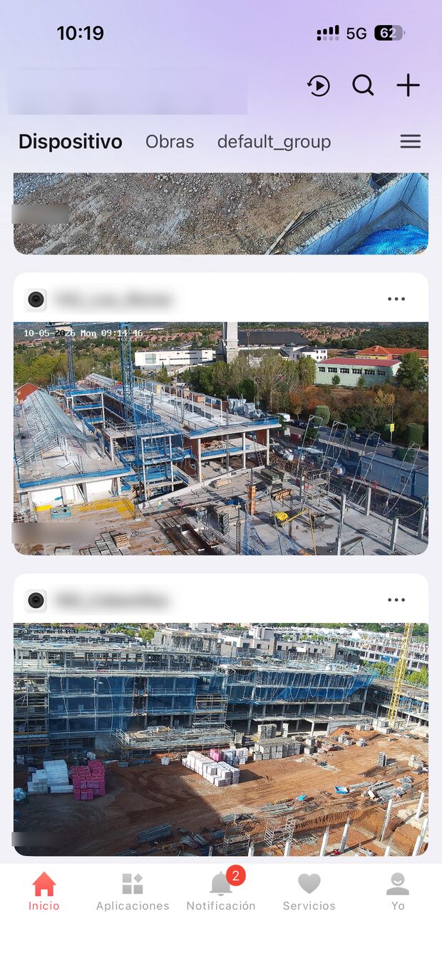Phone app listing the cameras of several building sites, each with a live picture